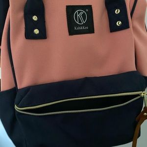 Navy blue and pink backpack purse